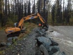 Crews place armour rock fast Yoder Road