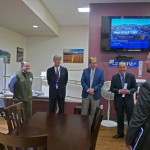 Assembly Member Steve Colligan, Mayor Vern Halter, Assembly Member Randall Kowalke, Manager Moosey, Tom Yang RBC Capital, and Andrew Ward, Fitch-Director US Public Finance, share a laugh before the presentation.