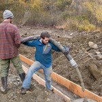 Sam Carlson operates the concrete hose.