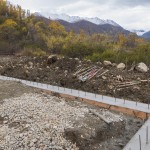 The concrete foundation for the vehicle storage building.